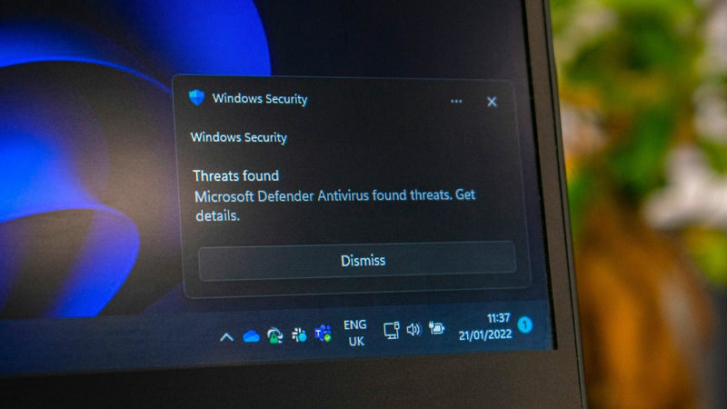 Ein Laptop-Bildschirm stellt ein Windows-Security-Pop-Up dar.